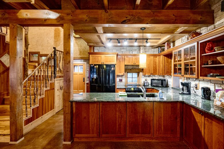 Kitchen with granite counters, cherry cabinetry and a view!