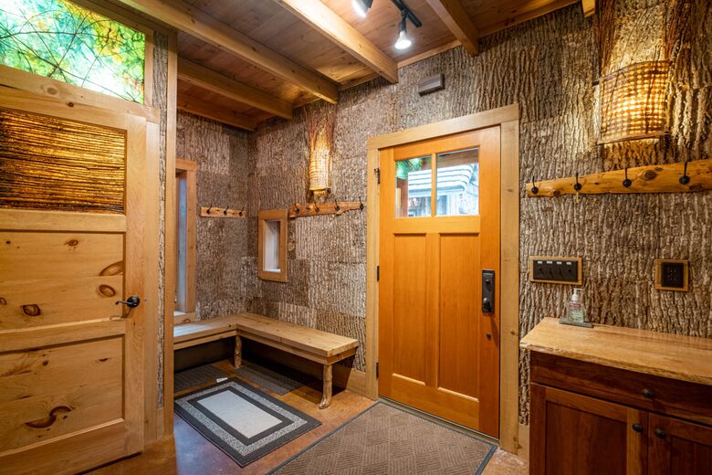 Entry area. Washer/dryer behind closet door. Bark walls.