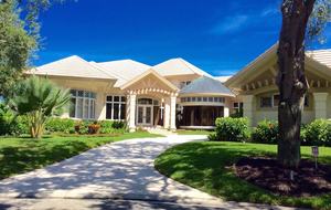 Bonita Bay Estate Home with glass walled dining room overlooking 10,000 gallon pond. - Bonita Springs, Florida
