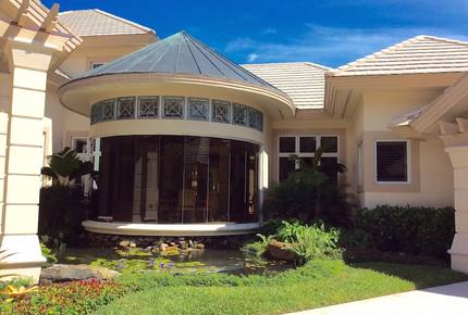 Bonita Bay Estate Home with glass walled dining room overlooking 10,000 gallon pond. - Bonita Springs, Florida