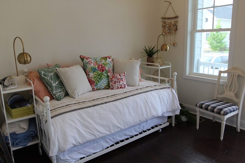 Main floor bedroom with two twin trundle bed, access to front porch
