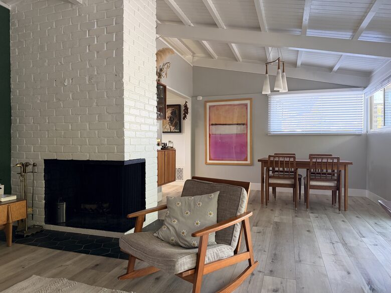 View of Dining area from living room. Working Fireplace.