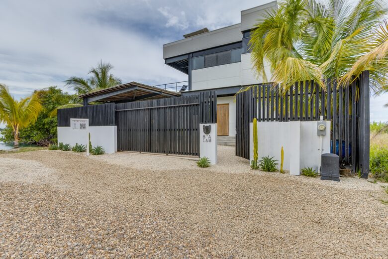 Casa Balam | Waterfront Villa with Boat, 40ft Pool & Rooftop Bar - Placencia, Belize