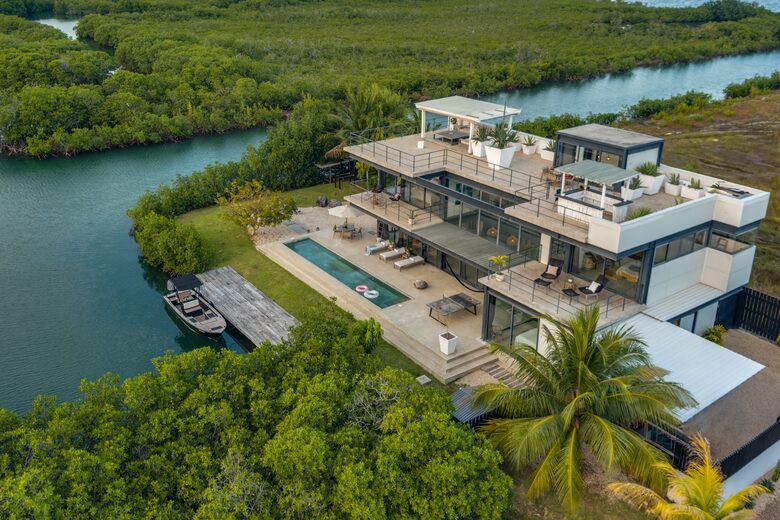 Casa Balam | Waterfront Villa with Boat, 40ft Pool & Rooftop Bar - Placencia, Belize