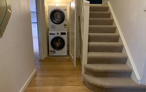 Washing machine and dryer located under the stairs