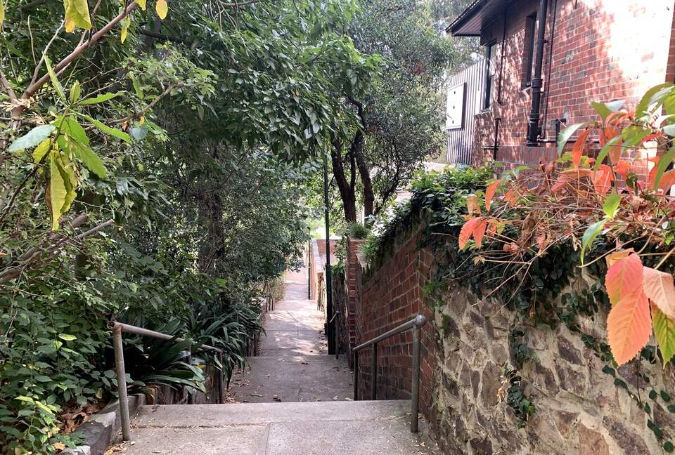 100 meters down the stairs to the bus stop and Yarra River