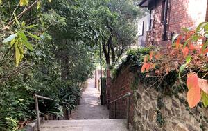 100 meters down the stairs to the bus stop and Yarra River
