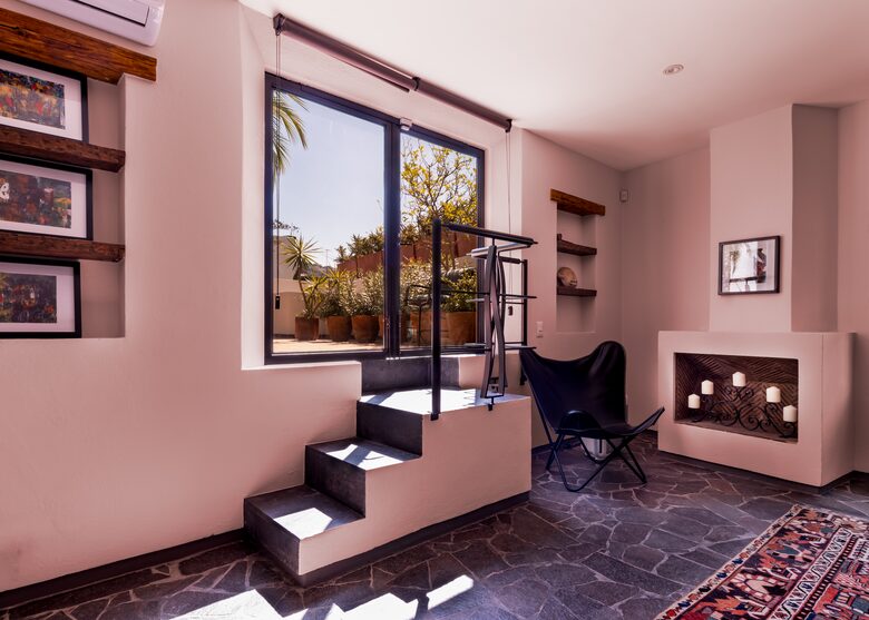 Entrance to second bedroom private patio/garden with pool view