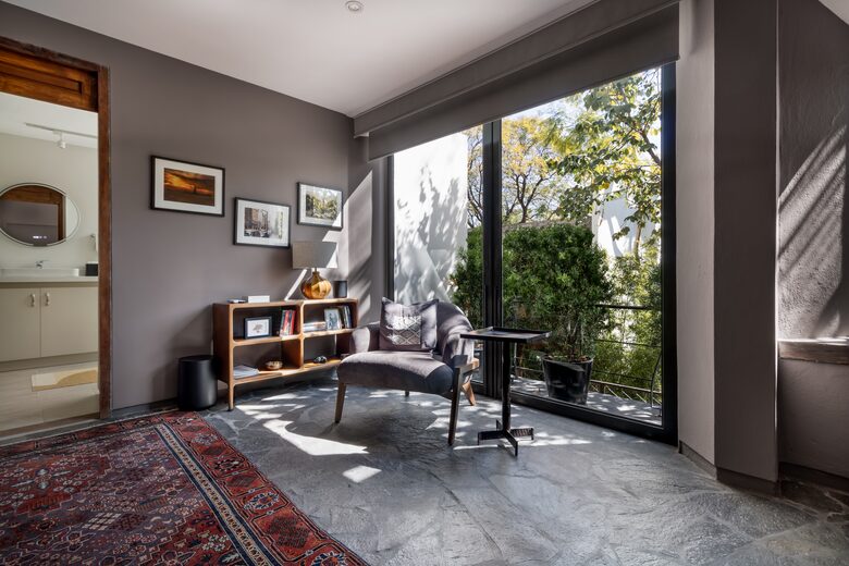 Primary bedroom sitting area and balcony