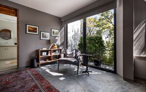 Primary bedroom sitting area and balcony
