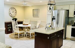 large eat in kitchen, with tons of cooking and baking tools