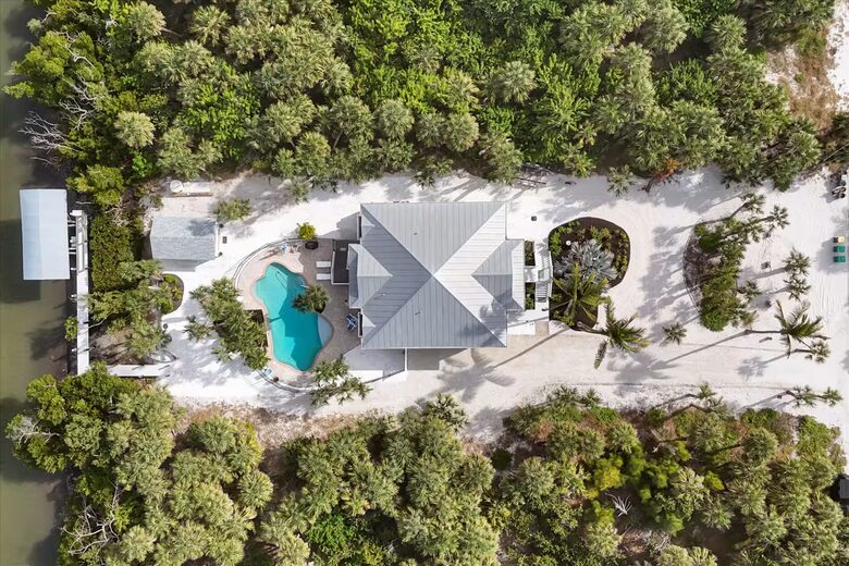 Secluded Gulf Retreat on Palm Island with Private Pool, Dock, Deeded Beach Access ! - Placida, Florida
