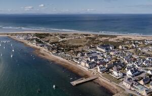 Tidal river in front of house, Moray Firth behind.