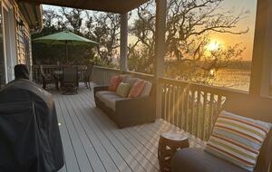 Main level deck with seating and dining area for 6