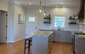 Kitchen with island seating for 3
