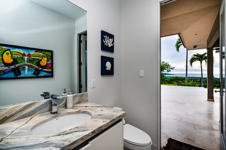 Pool Bathroom with Door to Deck Open