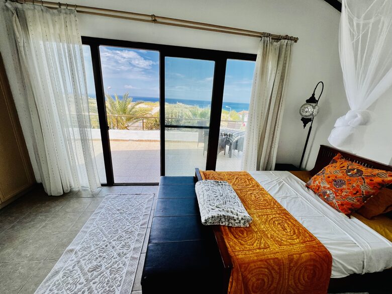 master bedroom with balcony and view