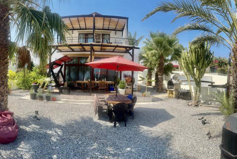 front of villa, top balcony and porch with dining ts,hammock+BBQ