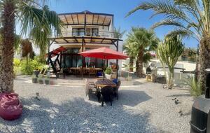 front of villa, top balcony and porch with dining ts,hammock+BBQ