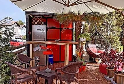 garden bar with full size fridge and egg chair