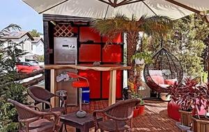garden bar with full size fridge and egg chair