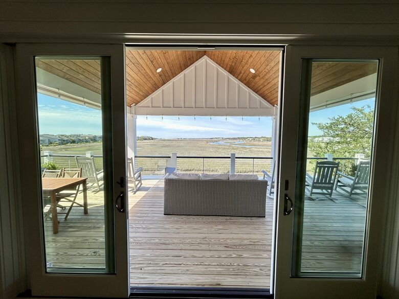 Den with Covered Deck & Waterfront Creek View
