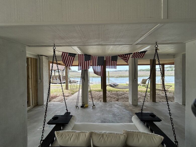 Covered Waterfront Lounge with Swing Bed