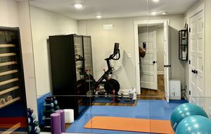 Gym with Peloton bike and free weights