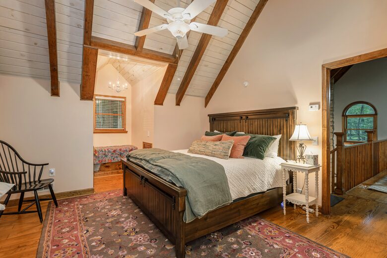 Upstairs bedroom with king size bed and connected bathroom.