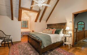 Upstairs bedroom with king size bed and connected bathroom.