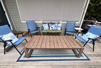 Bay view deck seating area, overlooks large lawn