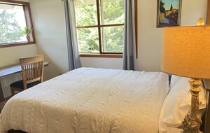 2nd floor queen, waterfront view and desk.