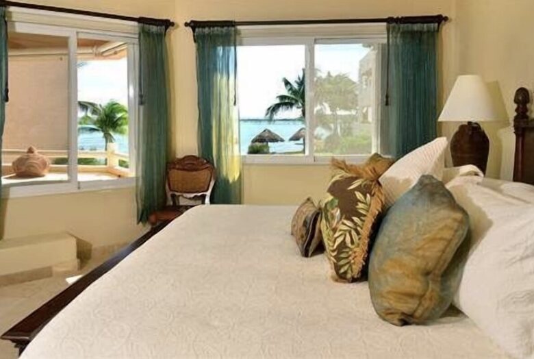 Master bedroom with ocean view king bed