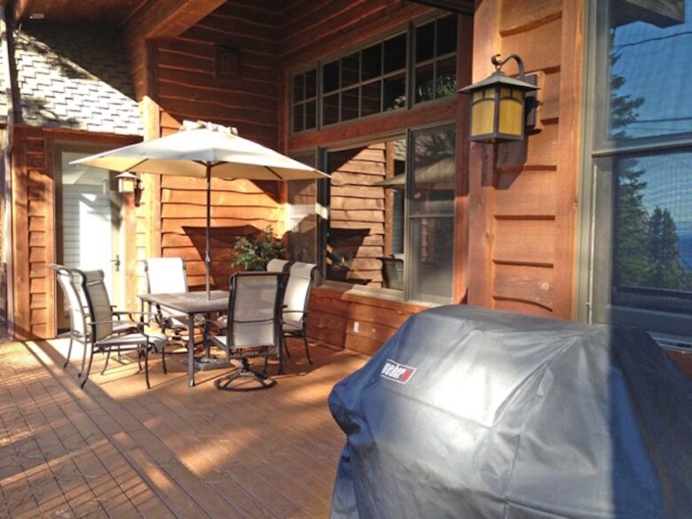Great wraparound deck, with bbq, dining table, lounge chairs and view