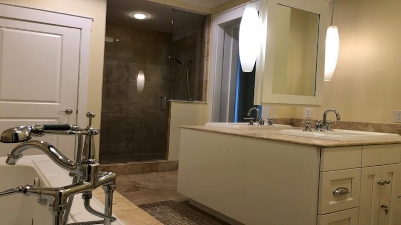 Master bathroom with glass shower and separate tub