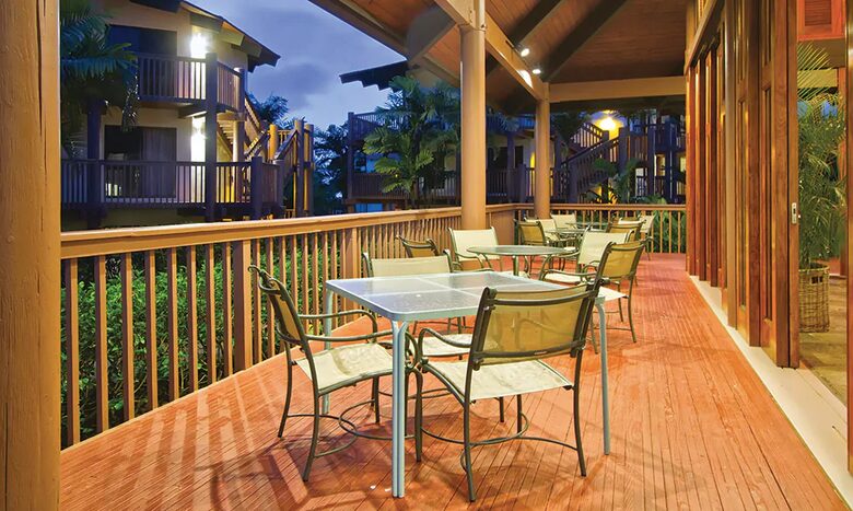 Home exchange at Wyndham Ka'Eo Kai, deck with patio seats and table