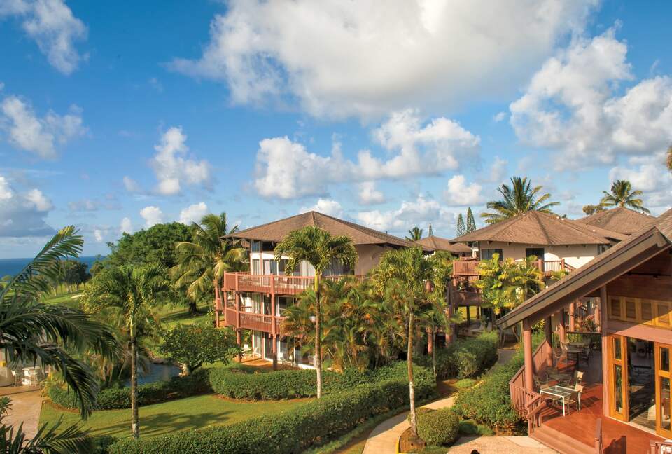 Home exchange at Wyndham Ka'Eo Kai Resort surrounded by palm trees