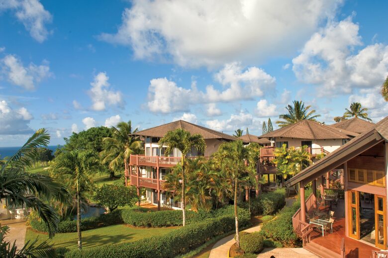 Home exchange at Wyndham Ka'Eo Kai Resort surrounded by palm trees