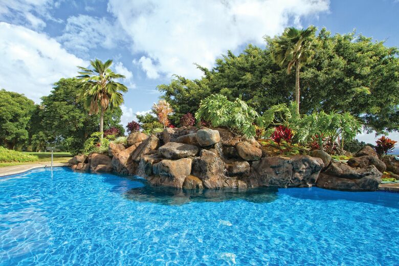Home exchange at Wyndham Ka'Eo Kai, resort pool with rock waterfall