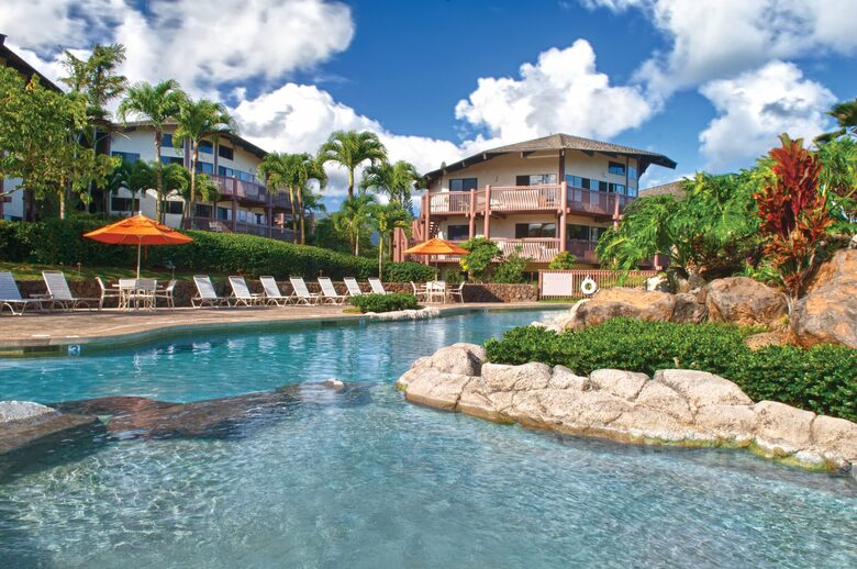Home exchange at Wyndham Ka'Eo Kai, resort pool with lounge seating