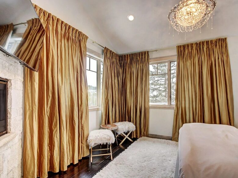 Home exchange in Breckenridge CO, master bedroom with gold curtains