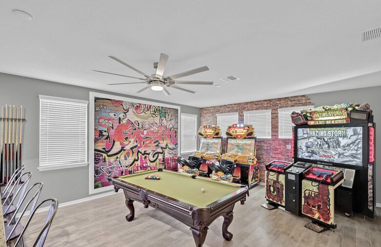 Home exchange in Kissimmee FL, loft game room with pool table & games