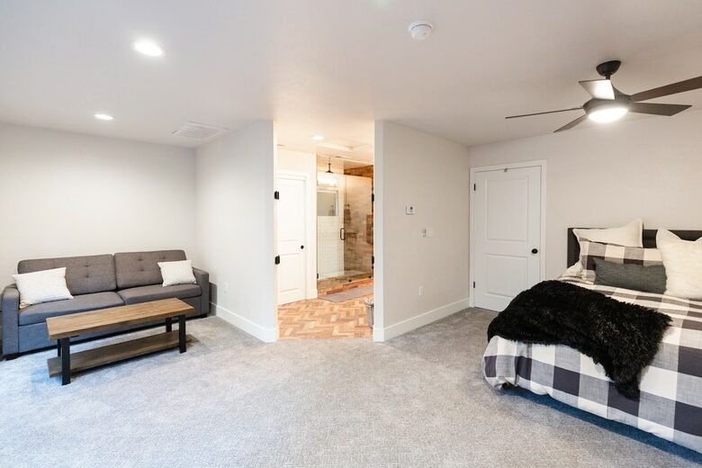 Home exchange in Bass Lake CA, small sofa in master bedroom