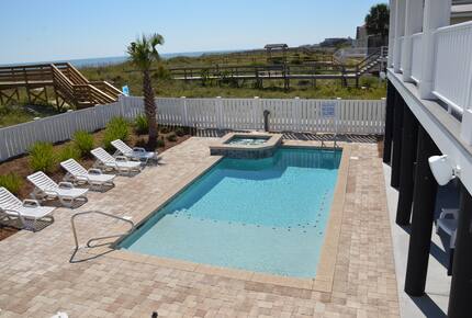 Home Exchange in Garden City, SC, resort style pool and hot tub