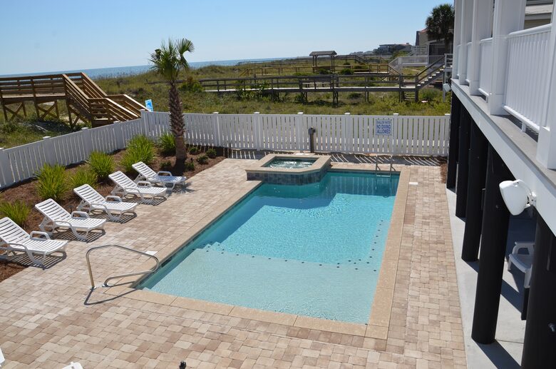 Home Exchange in Garden City, SC, resort style pool and hot tub