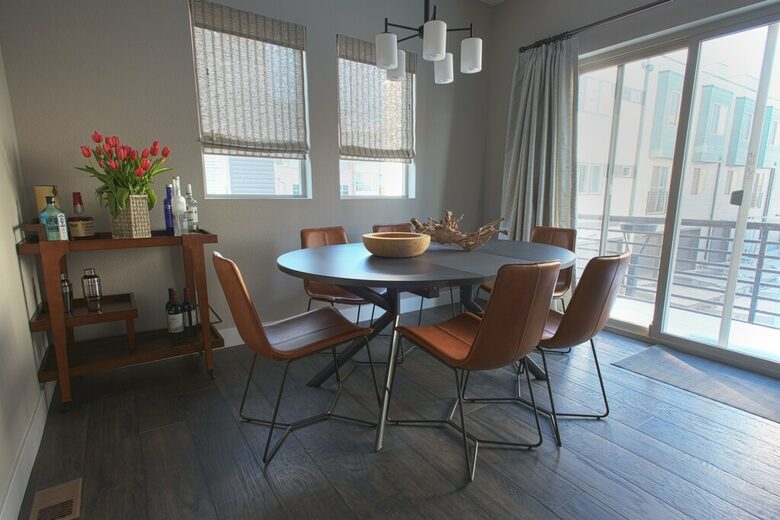 Home Exchange in Denver, CO, luxury townhome dining space with balcony