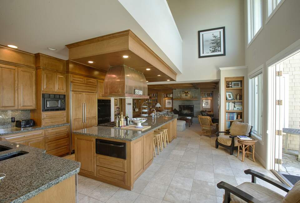 Open chef's kitchen with massive island