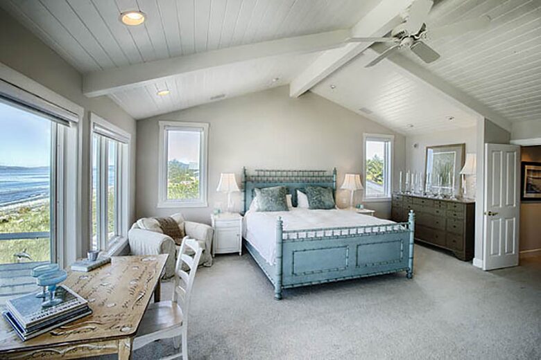 Master bedroom with large patio facing water