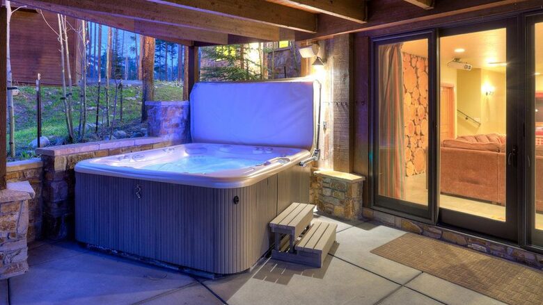 Home Exchange in Breckenridge, CO lower patio with hot tub