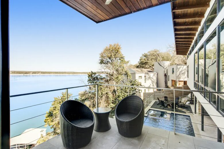 Home Exchange in Austin, TX patio with sweeping lake and pool views
